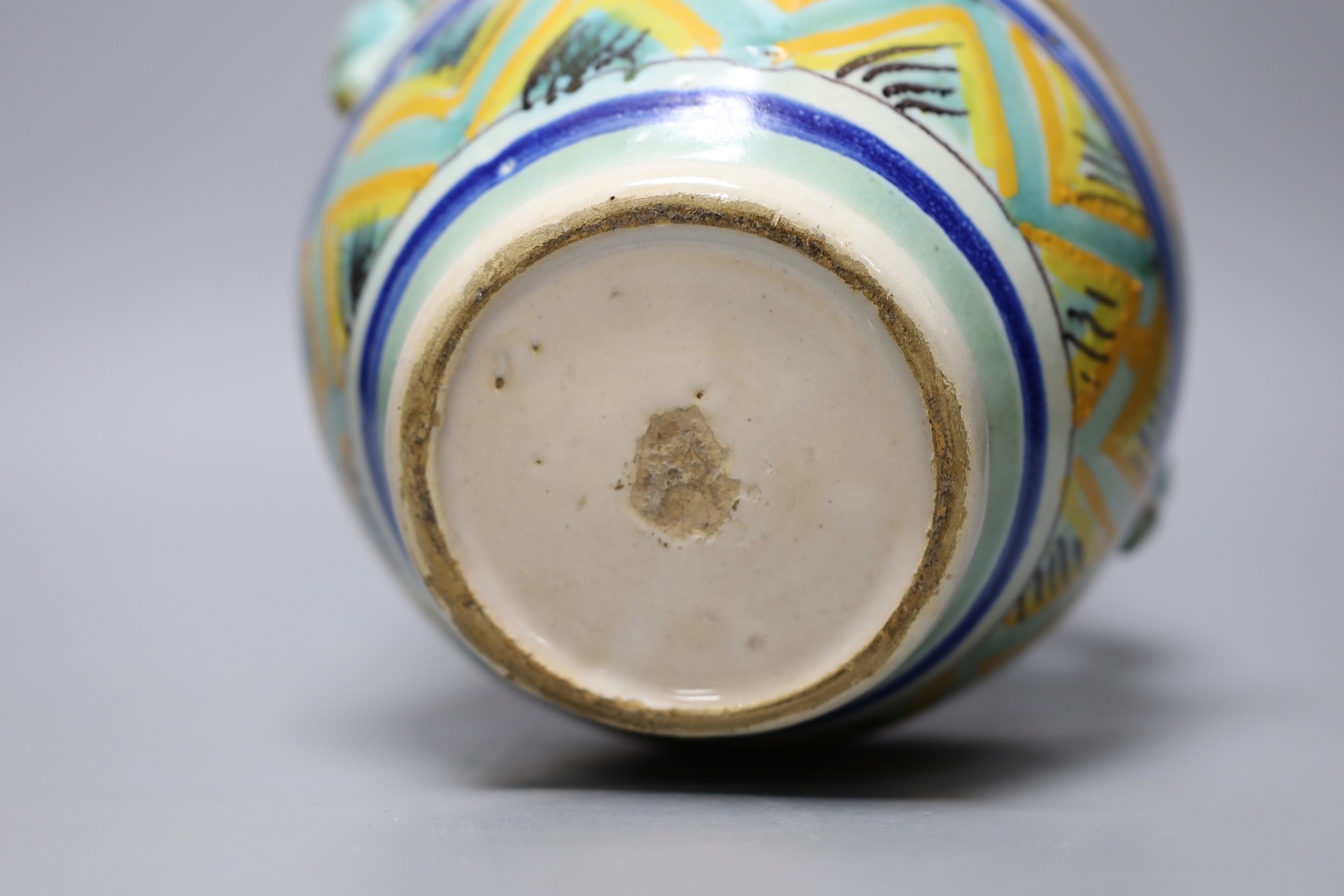 A Italian maiolica vase decorated with hares, 23cm tall